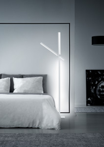 White minimalistic bedroom interior with king-size bed, lamps and painting